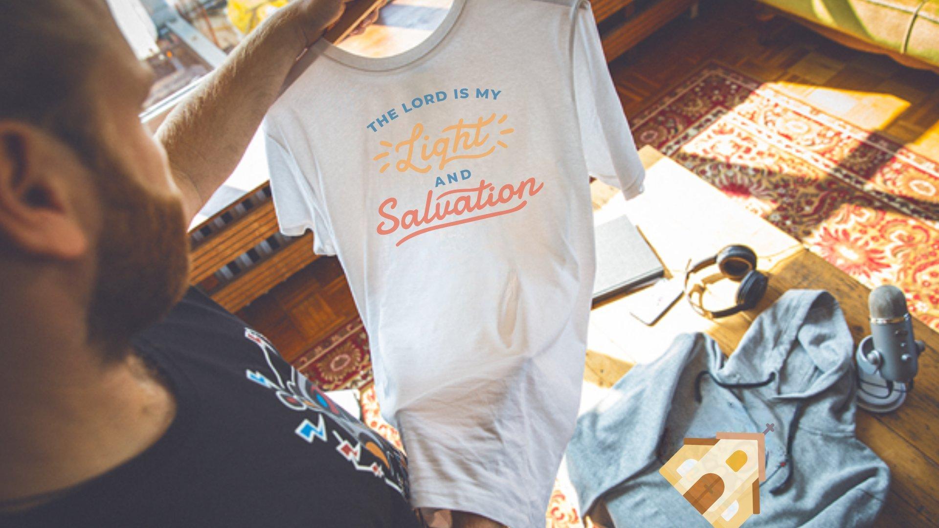 person unboxing their own custom church tshirt